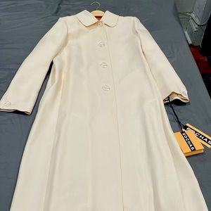 Light pink duster coat. Never worn. Size 48. Circa 2014. Coat bag included